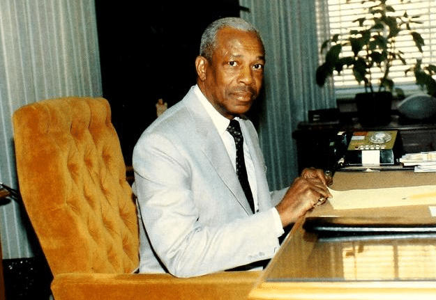 Leroy T. Walker sitting at his desk